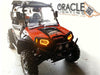 Three quarters view of a Polaris RZR with amber headlight halos installed.
