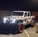 Three quarters view of a Jeep Gladiator JT with a VECTOR Pro-Series LED Grill installed.
