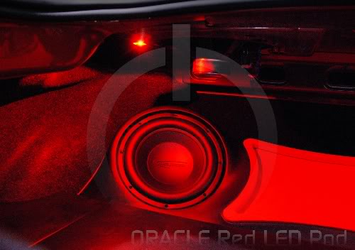 Speaker system with red LED pod behind