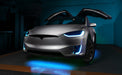 Silver Tesla Model X with cyan headlight and fog light DRLs.