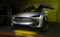 Silver Tesla Model X with yellow headlight and fog light DRLs.
