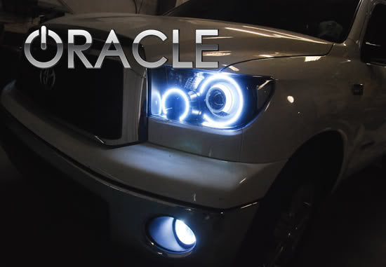 Close-up of on the front end of a Toyota Tundra with white LED headlight and fog light halos installed.