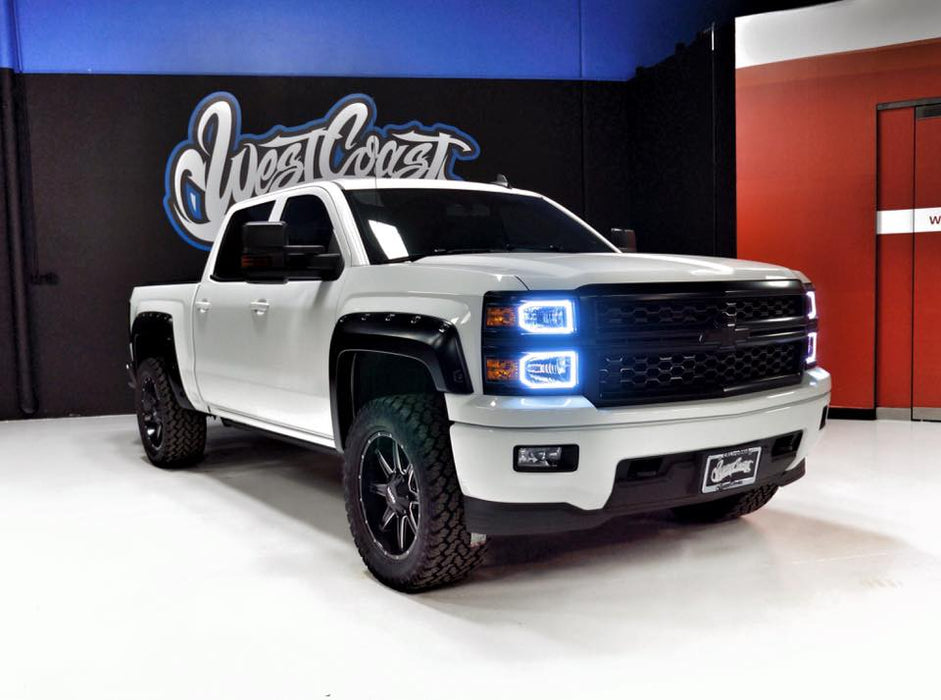 Three quarters view of a Chevrolet Silverado with white LED halo rings installed.