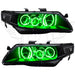 Acura TSX headlights with green LED halo rings.