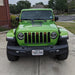 Front end of a green Jeep Gladiator JT with amber Pre-Runner Style LED Grill Light Kit installed.