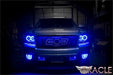 Front view of a Chevrolet Avalanche with blue LED headlight and fog light halo rings installed.