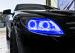 Close-up on the headlight of a Mercedes Benz CL 500 with blue LED halo rings.