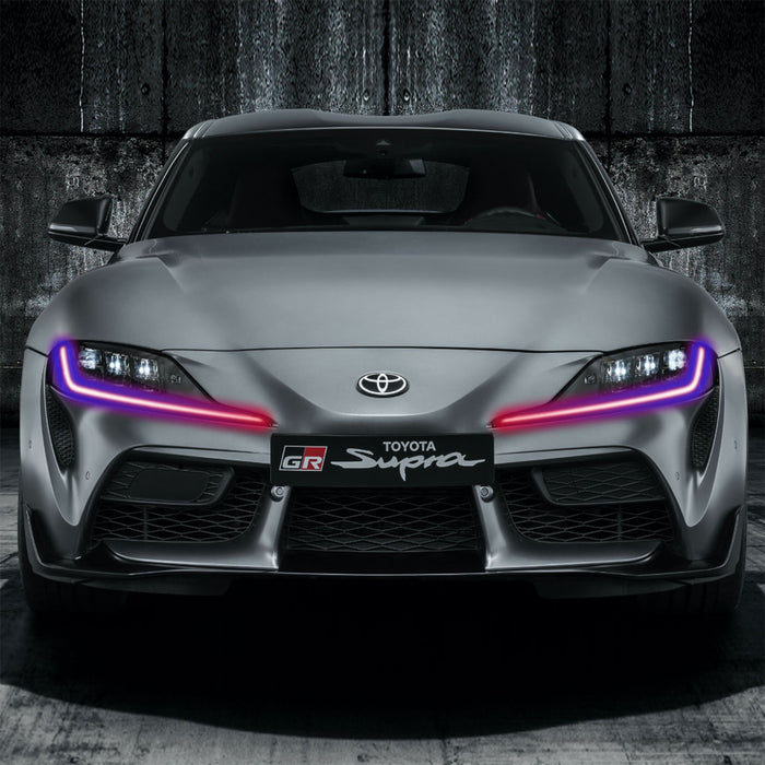 Front view of a Toyota Supra with multicolored headlight DRLs.