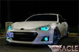 Three quarters view of a Subaru BRZ with cyan LED headlight halo rings installed.