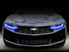Front end of a Chevrolet Camaro with blue headlight DRLs.