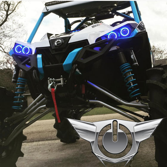 Can-Am Maverick with blue LED headlight halo rings installed.