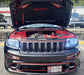 Front end of a Jeep Grand Cherokee with white LED headlight halo rings installed.