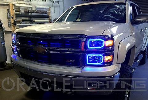 Three quarters view of a Chevrolet Silverado with blue LED halo rings installed.