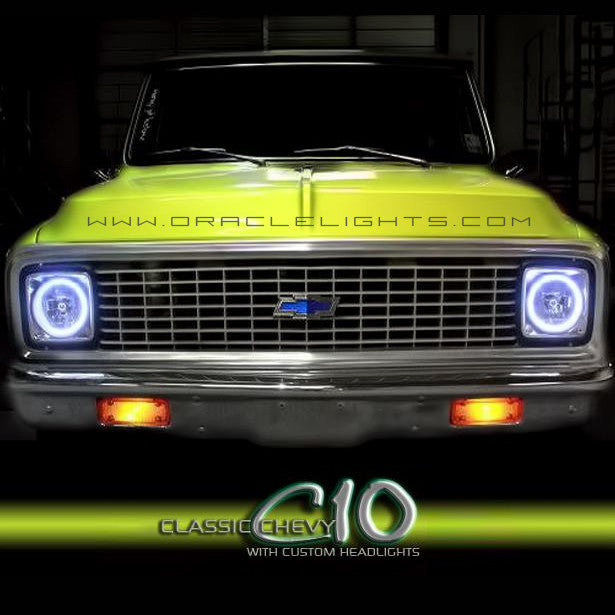 Front end of a Chevrolet C10 Truck with white LED headlight halo rings installed.