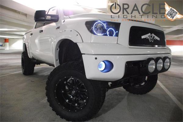 Three quarters view of a Toyota Tundra with white LED headlight halo rings installed.