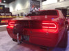 Rear end of a Dodge Challenger with Afterburner LED Tail Light Halo Kit installed.