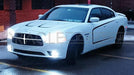 Three quarters view of a Dodge Charger with white LED Illuminated Grill Crosshairs installed.