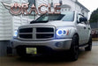 Three quarters view of a Dodge Durango with white LED headlight halo rings installed.