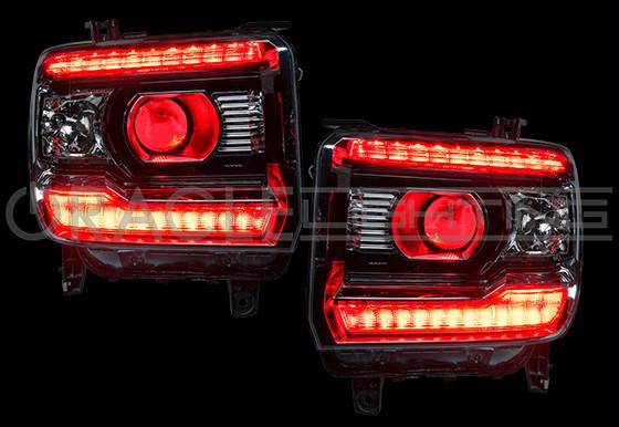 GMC Sierra headlights with red DRLs.