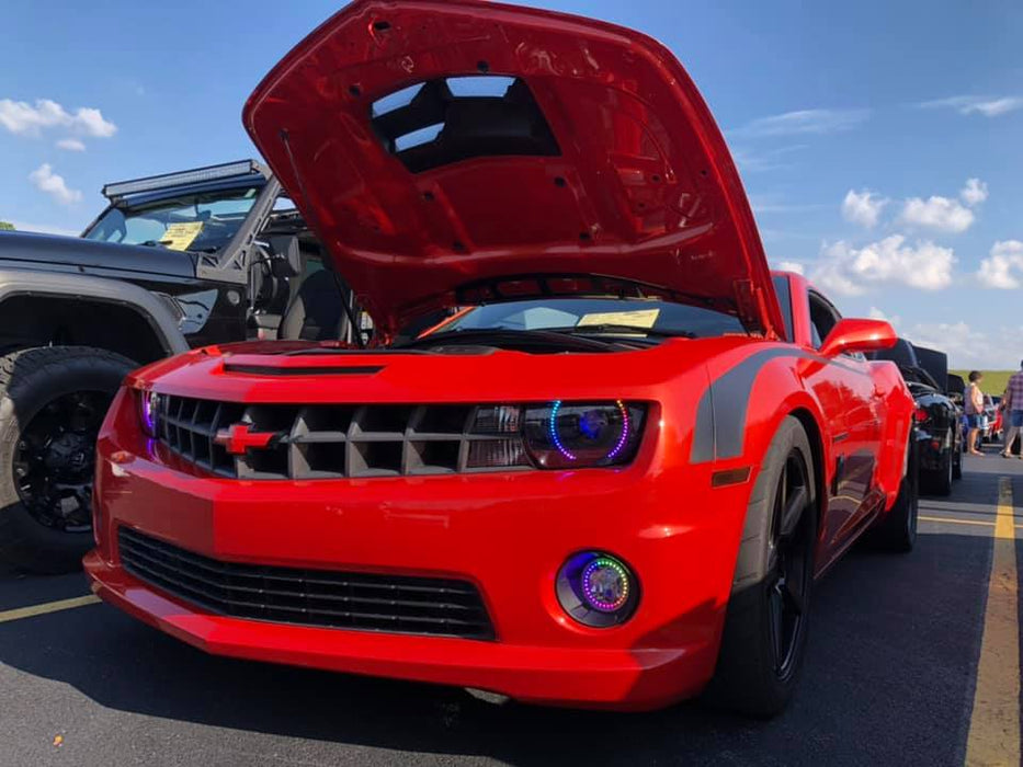 Red camaro with hood open and dynamic colorshift halo headlights and fog lights