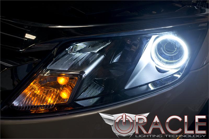Close-up of a white LED headlight halo ring installed on a Ford Fusion.