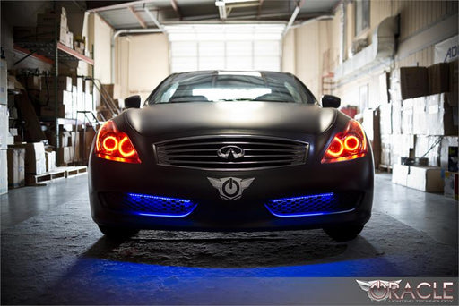 Front end of an Infiniti G37 with red LED headlight halos installed.