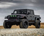 Lifestyle image of a Jeep Gladiator JT with green Pre-Runner Style LED Grill Light Kit installed.