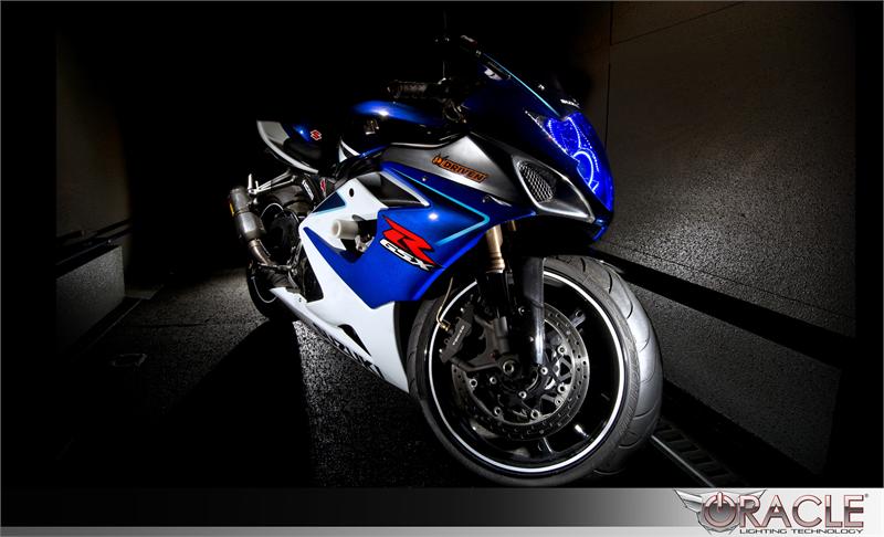 Three quarters view of a Suzuki GSX-R 1000 with blue LED headlight halo rings installed.