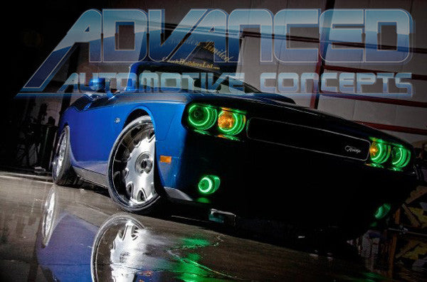 Low aggressive shot of a blue Dodge Challenger with green LED headlight and fog light halo rings installed.