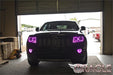 Front end of a Jeep Grand Cherokee with pink LED headlight and fog light halos.