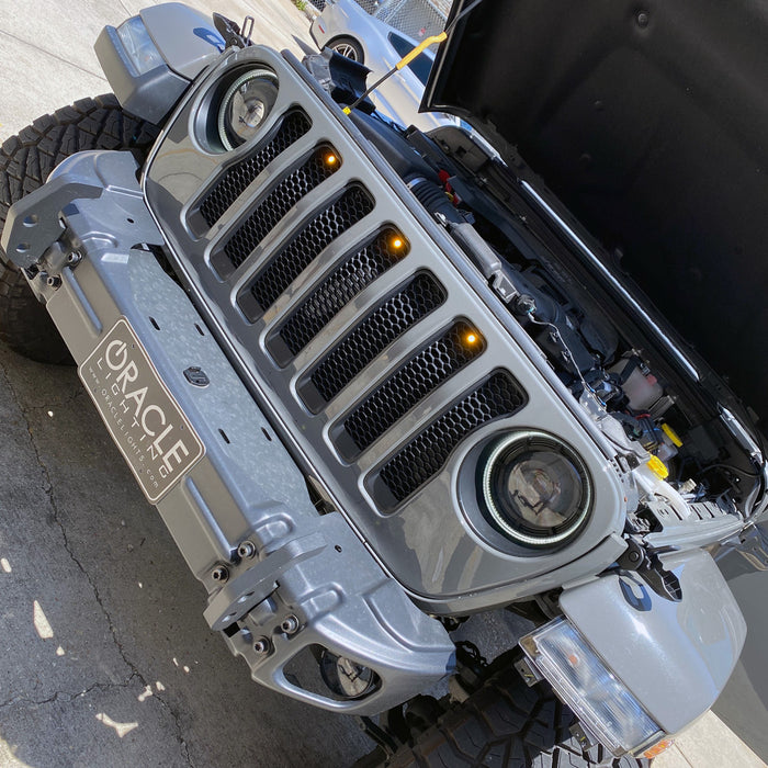 pre-runner style LED grill light kit installed on jeep with hood open