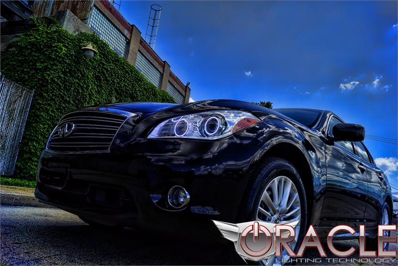 Low aggressive shot of an Infiniti M37 with white LED headlight halo rings installed.