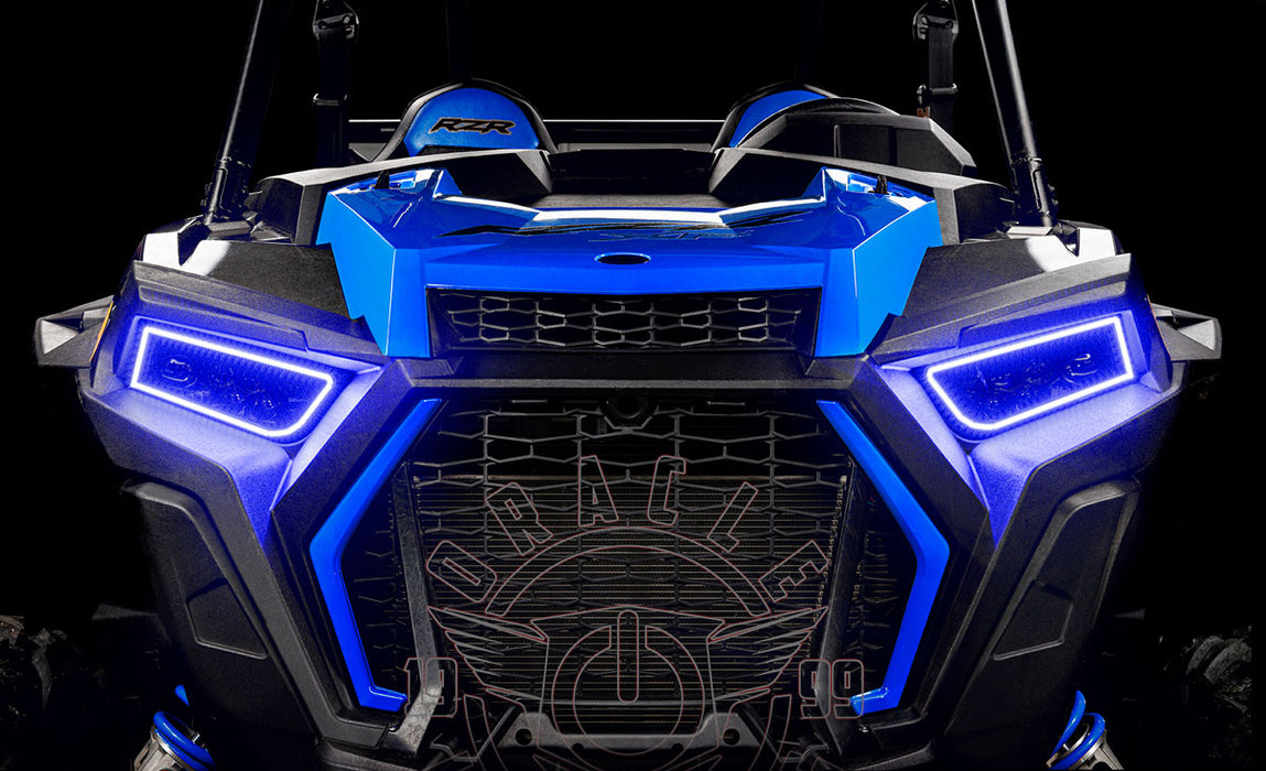 Close-up of RZR grill with blue DRL headlights