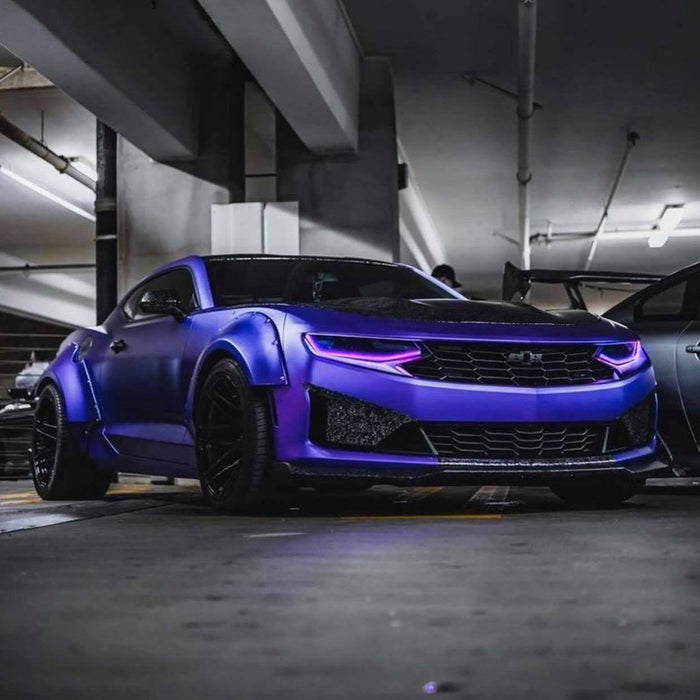 Three quarters view of a purple Chevrolet Camaro, equipped with purple LED Surface Mount Headlight DRL Modules.