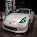 Three quarters view of a Nissan 370Z with green LED headlight halos installed.
