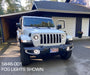 Front end of a white Jeep with Oculus Headlights and High Powered Fog Lights installed.