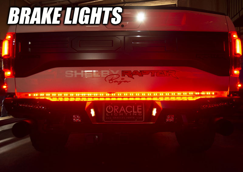 Rear view of Ford Raptor with LED truck tailgate light bar brake lights on