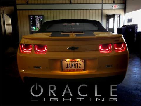 Rear view of a yellow Camaro with Afterburner Tail Light halos installed
