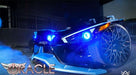 Front end of a Polaris Slingshot with blue headlight halo rings.