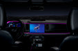 View of a Ford Bronco dashboard from the backseat, with pink fiber optic lighting installed.