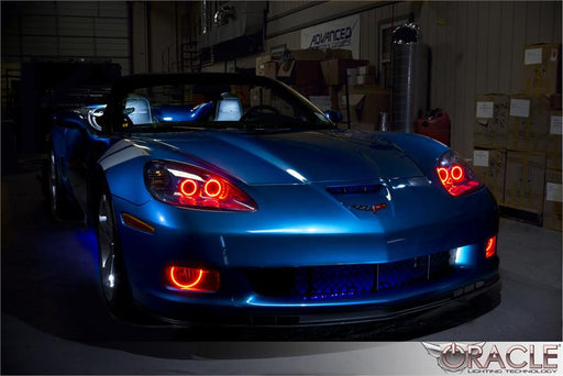 Front end of a C6 Corvette with red LED fog light halo rings.
