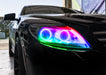 Close-up on the headlight of a Mercedes Benz CL 500 with rainbow LED halo rings.