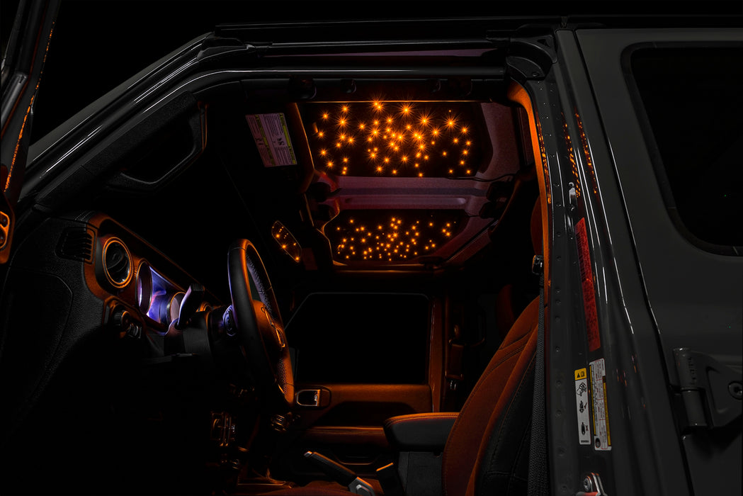 Jeep interior with StarLINER Fiber Optic Hardtop Headliner installed on the roof panels, set to amber LEDs.