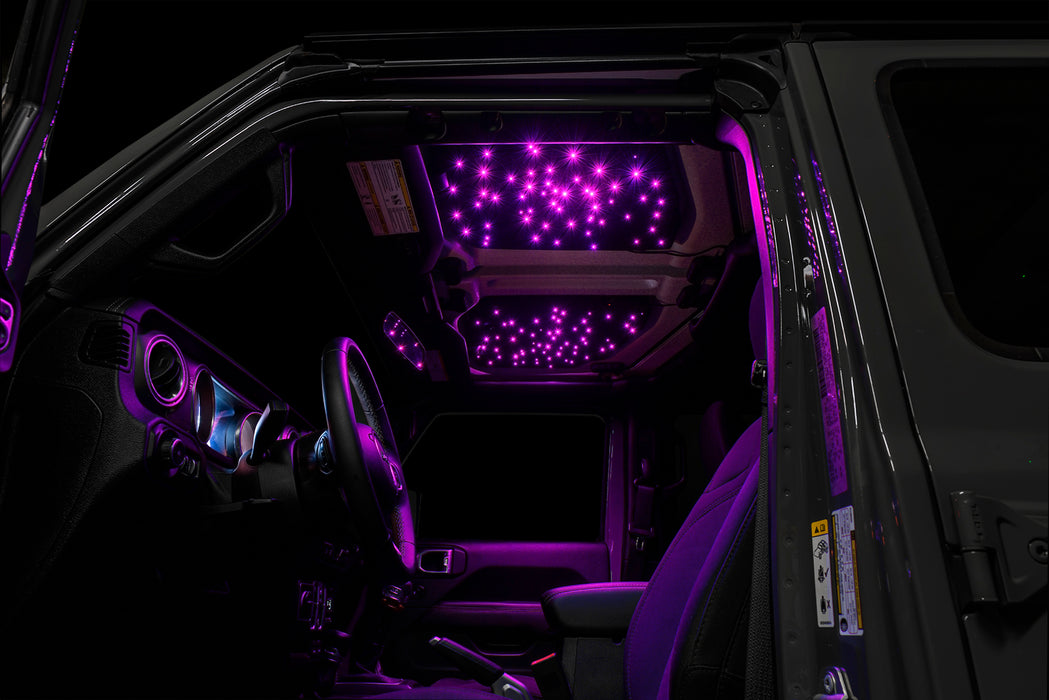Jeep interior with StarLINER Fiber Optic Hardtop Headliner installed on the roof panels, set to pink LEDs.
