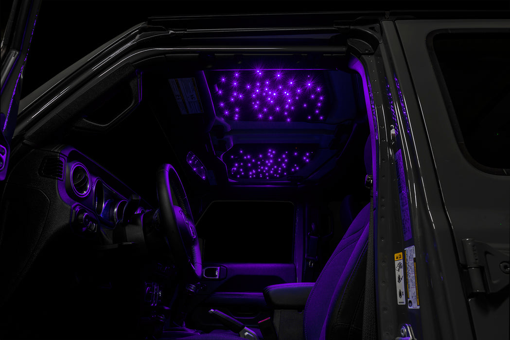 Jeep interior with StarLINER Fiber Optic Hardtop Headliner installed on the roof panels, set to purple LEDs.