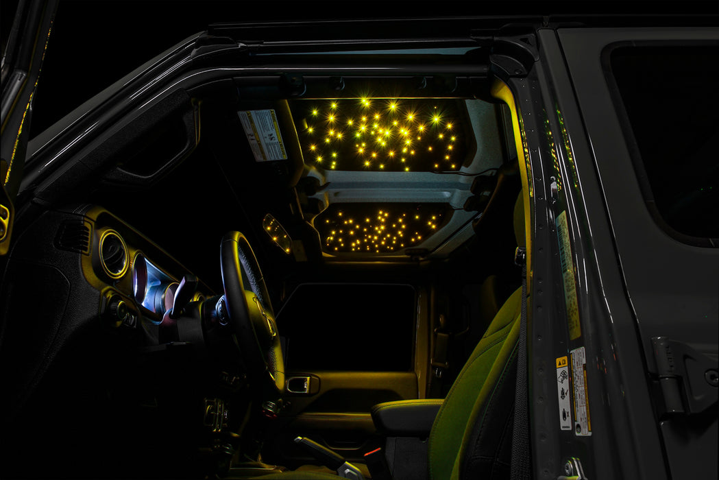 Jeep interior with StarLINER Fiber Optic Hardtop Headliner installed on the roof panels, set to yellow LEDs.