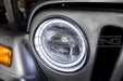 Close-up of white LED halo ring installed on a Jeep.
