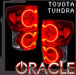 Toyota Tundra tail lights with halos glowing. ORACLE Lighting logo in bottom corner