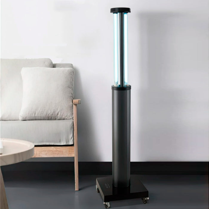 UV-C disenfection device standing up next to a couch and table
