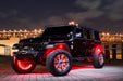 Three quarters view of a black Jeep Wrangler JL with VECTOR Pro-Series LED Grill installed.